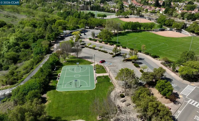 an aerial view of a house with a yard