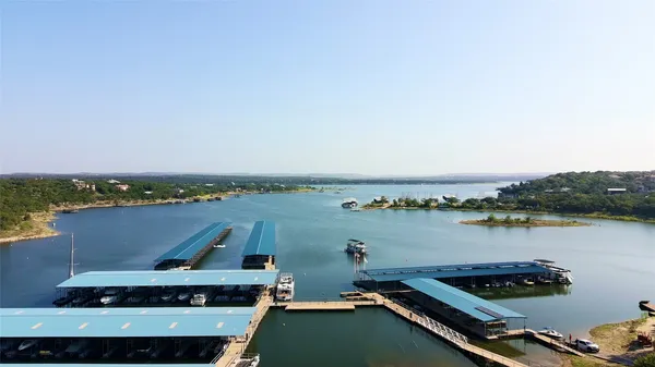 an aerial view of a house with a lake view