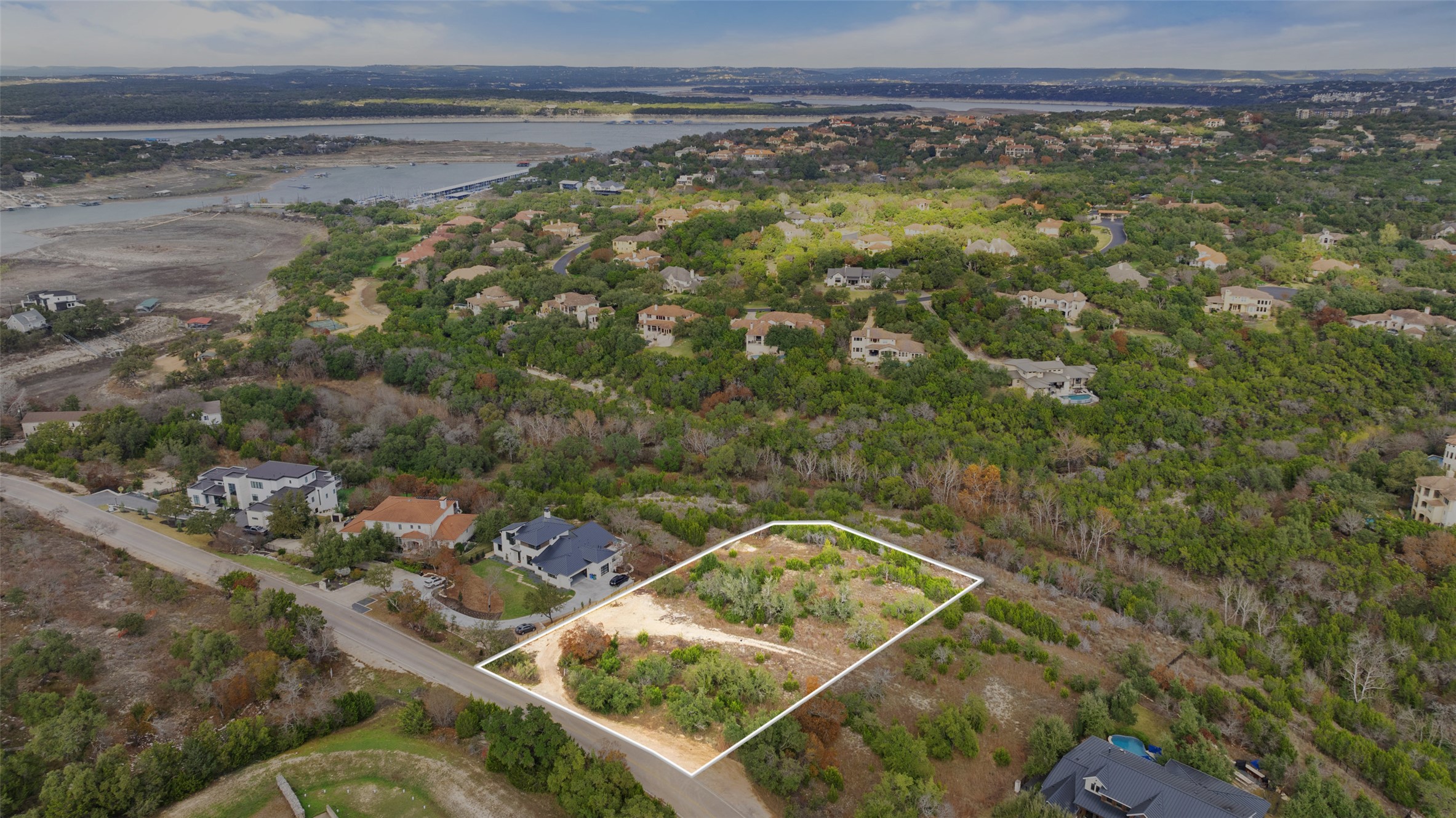 16130 Clara Van Street Austin, TX 78734 - Photo 6 of 20 Aerial view of property's location with property parcel outlined and a nearby body of water