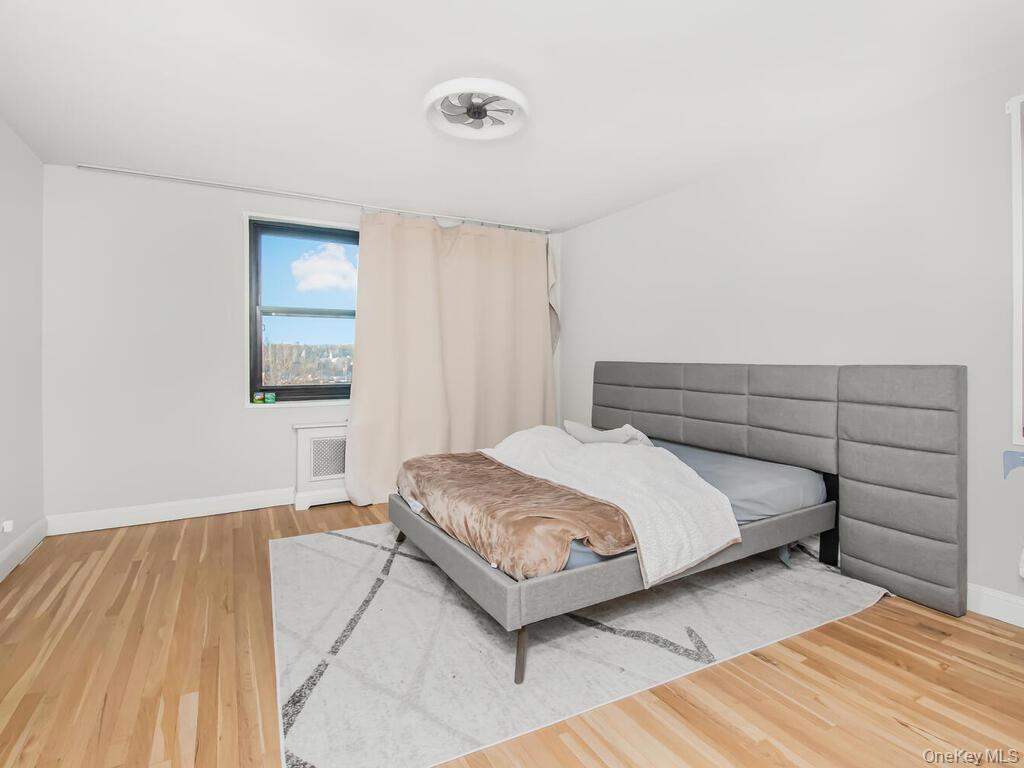 a bedroom with a bed and a night stand