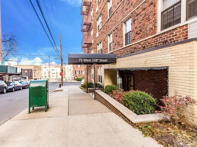 a view of a building with sitting area