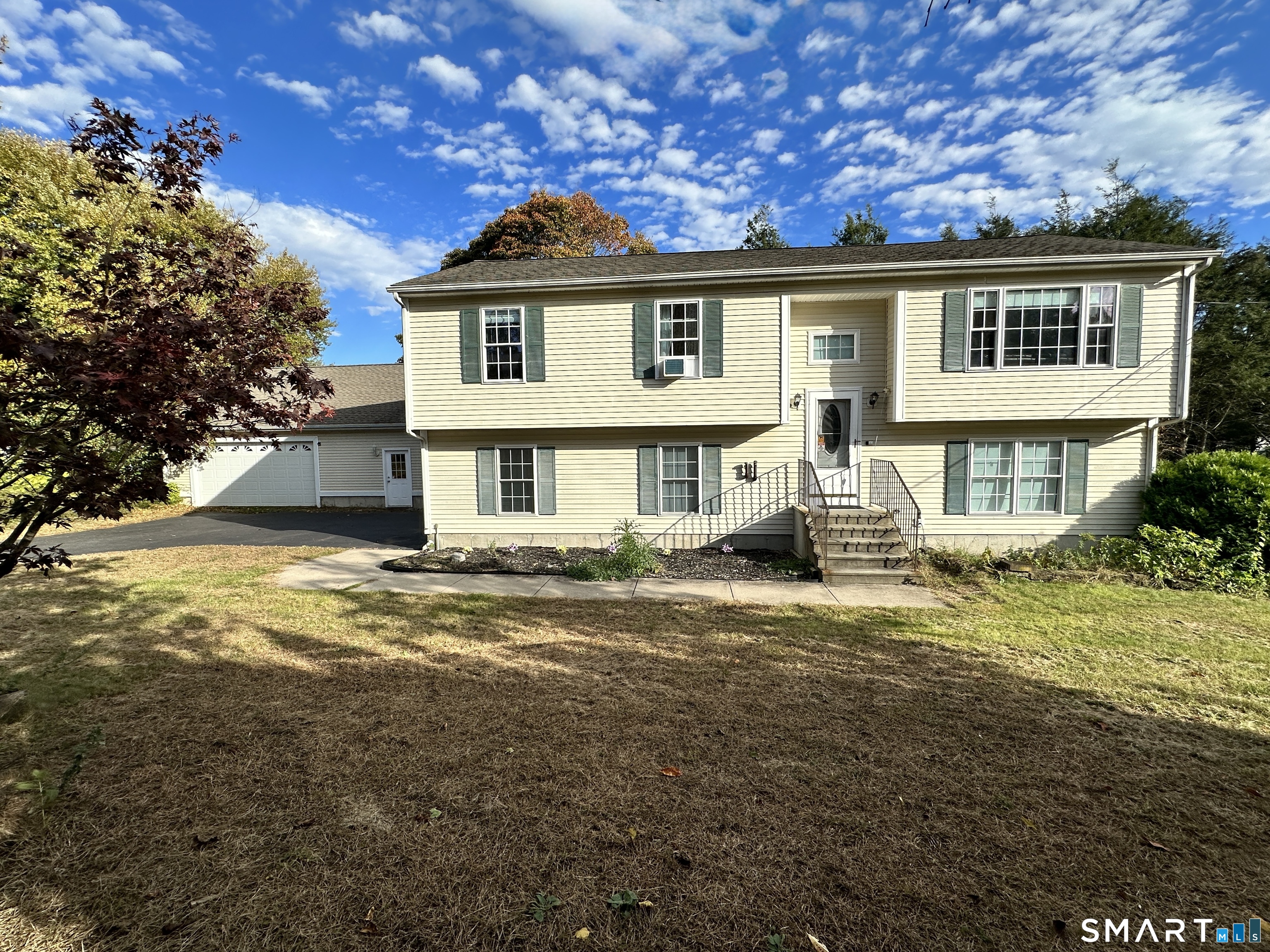 a front view of a house with a yard