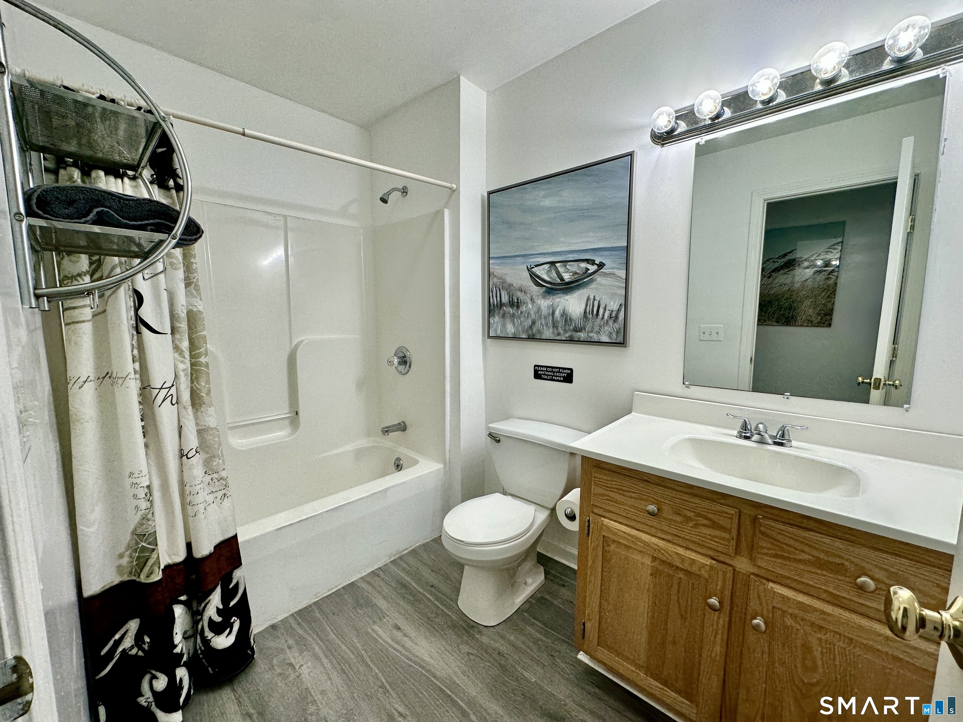 24 Quarry Street Norwich, CT 06360 - Photo 15 of 20 a bathroom with a sink a toilet a mirror and shower