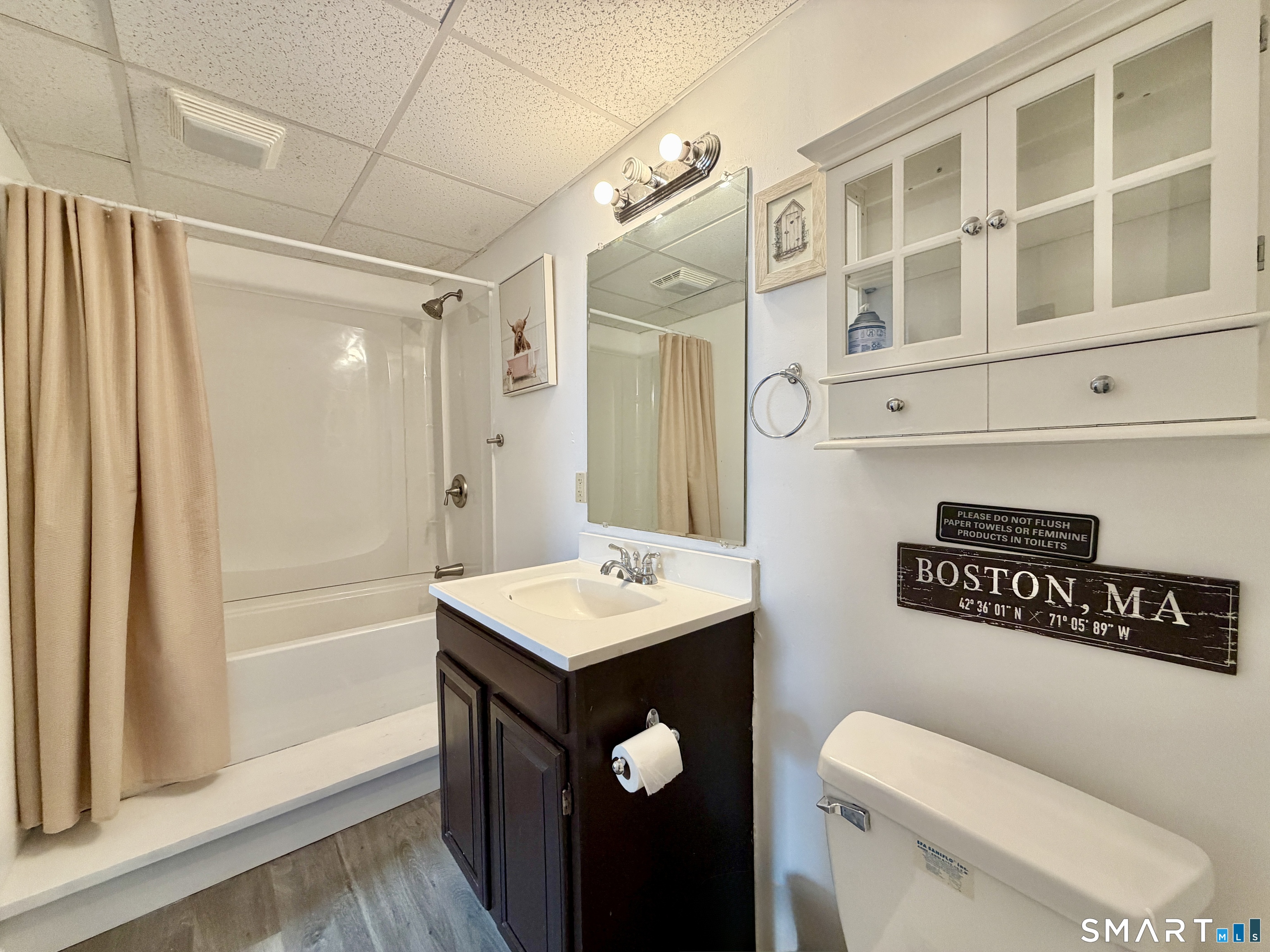 24 Quarry Street Norwich, CT 06360 - Photo 18 of 20 a bathroom with a sink a toilet and shower