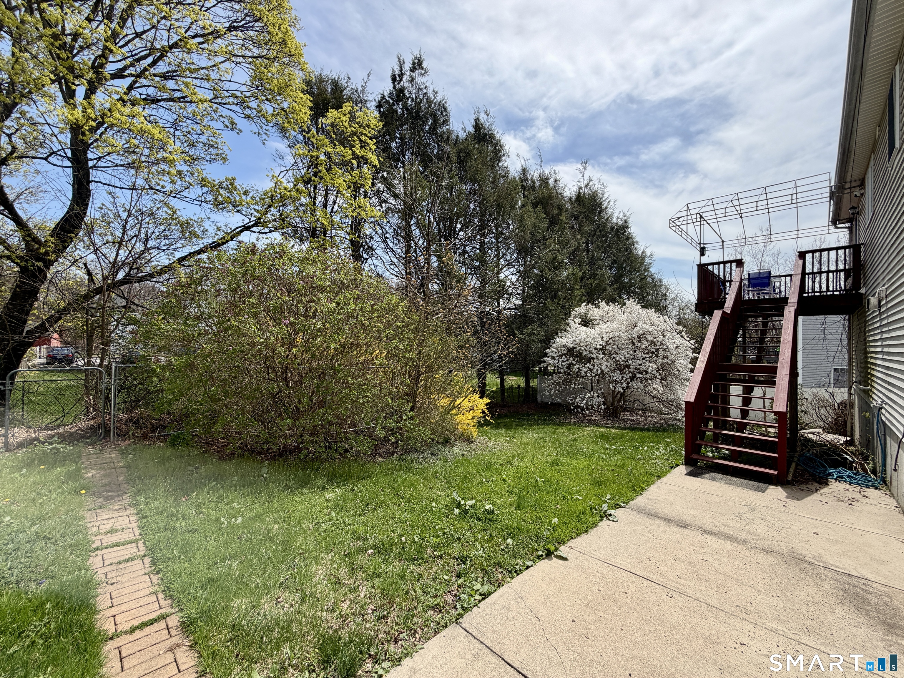 24 Quarry Street Norwich, CT 06360 - Photo 20 of 20 a view of a backyard with sitting area