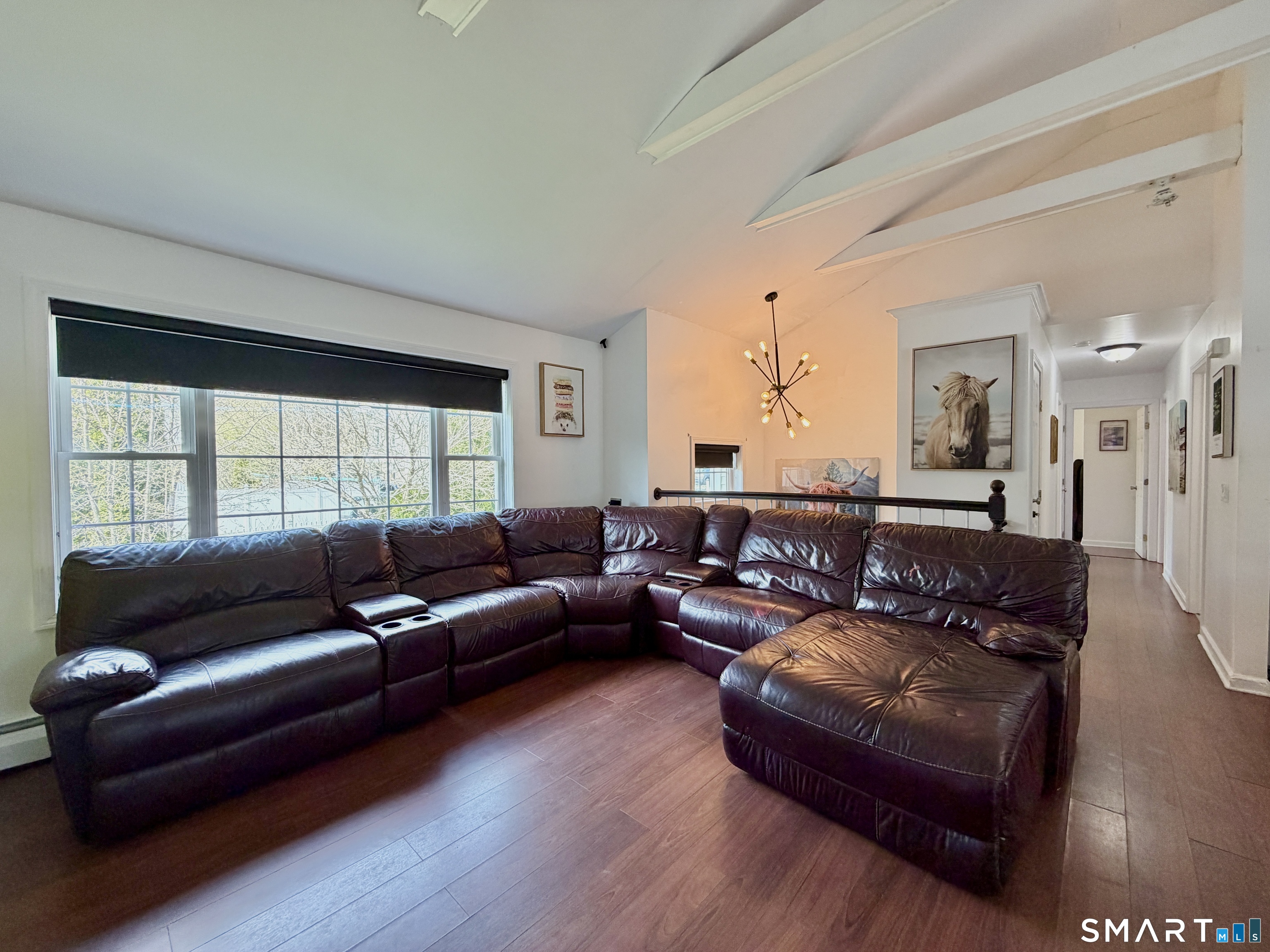 24 Quarry Street Norwich, CT 06360 - Photo 8 of 20 a living room with furniture and a large window