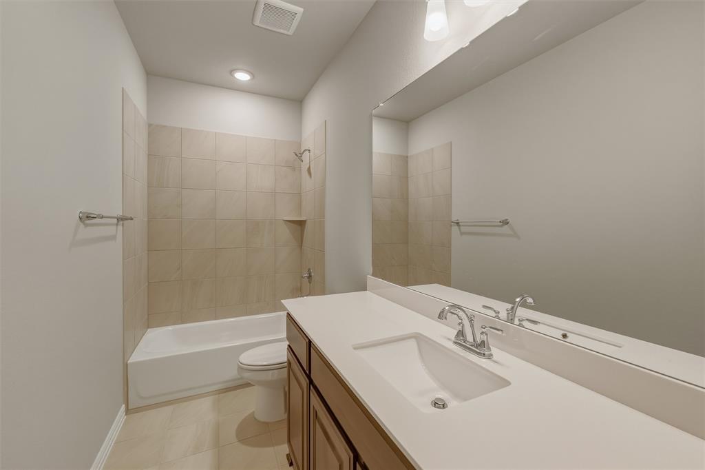 1232 Colca Drive Springtown, TX 76082 - Photo 13 of 23 Bathroom featuring a wide vanity with an integrated sink, polished chrome faucet, and expansive mirror
