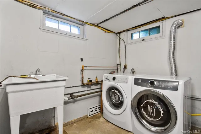 a utility room with dryer and washer