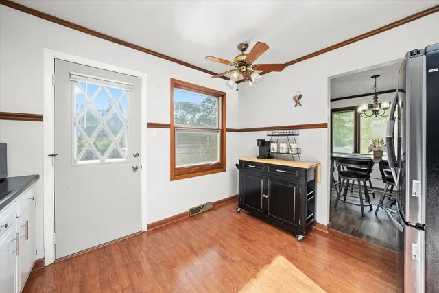 a living room with furniture a flat screen tv and a window