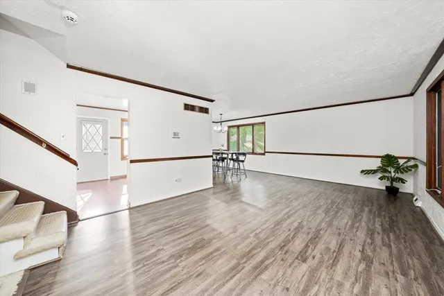 a view of hallway with wooden floor