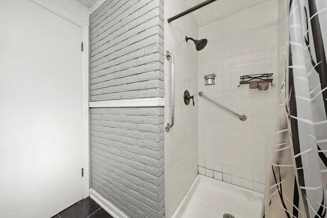 a view of storage and utility room with washer and dryer