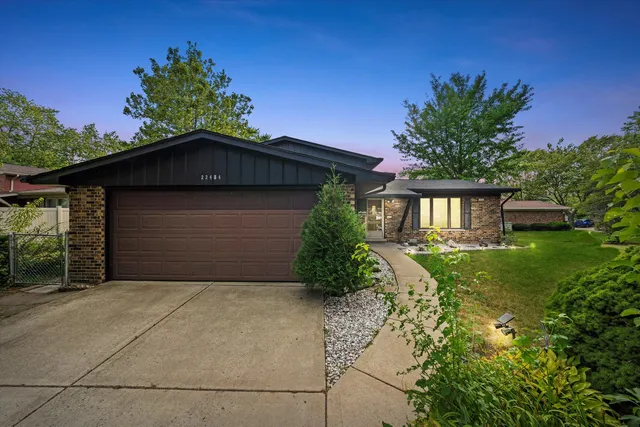 an aerial view of a house with a garden