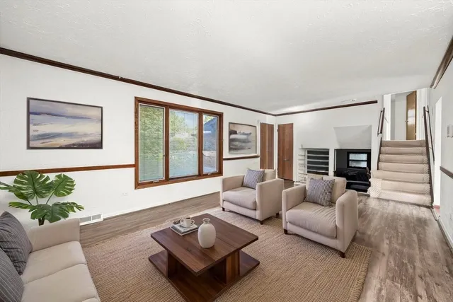 a living room with furniture and a large window