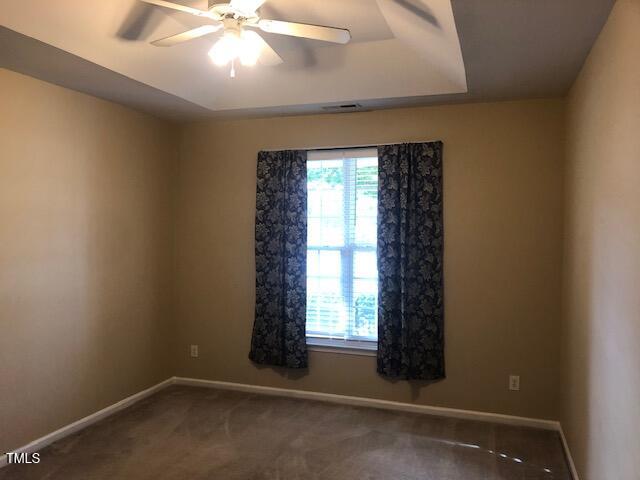 125 Hardaway Point Clayton, NC 27527 - Photo 5 of 17 an empty room with a window and ceiling fan