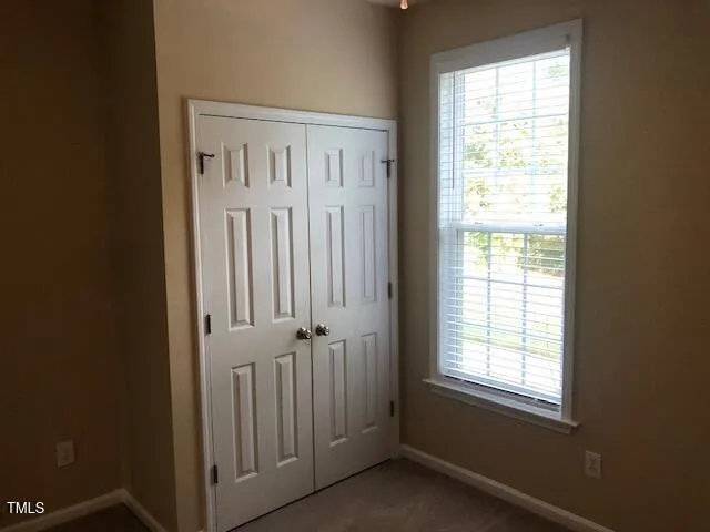 an entryway with a window in a room
