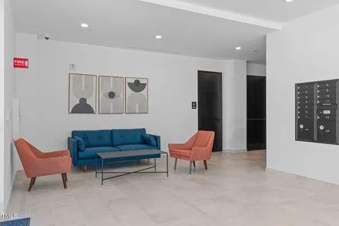 a living room with furniture and a rug