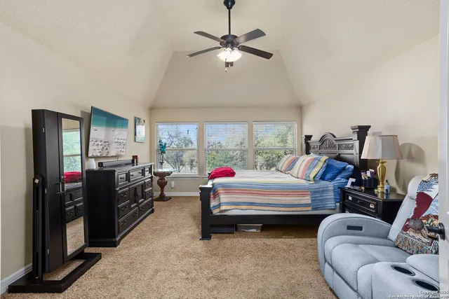 a bedroom with bed and window