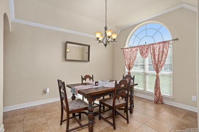 a view of a dining room with furniture window and outside view