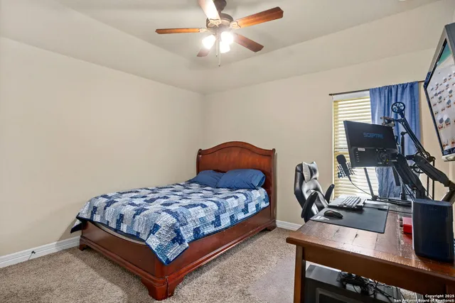 a bedroom with a bed and dresser