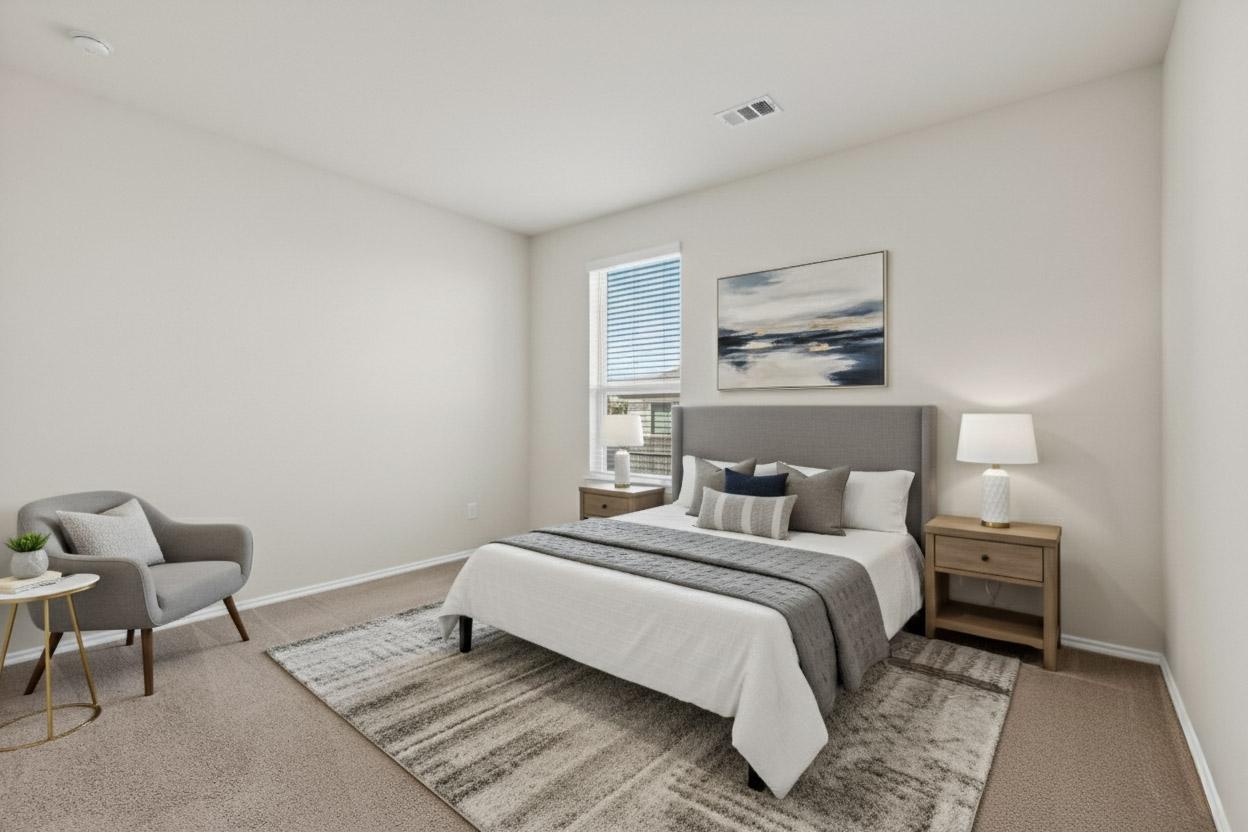 429 Stone Water Lane Jarrell, TX 76537 - Photo 15 of 37 a bedroom with a bed and chair