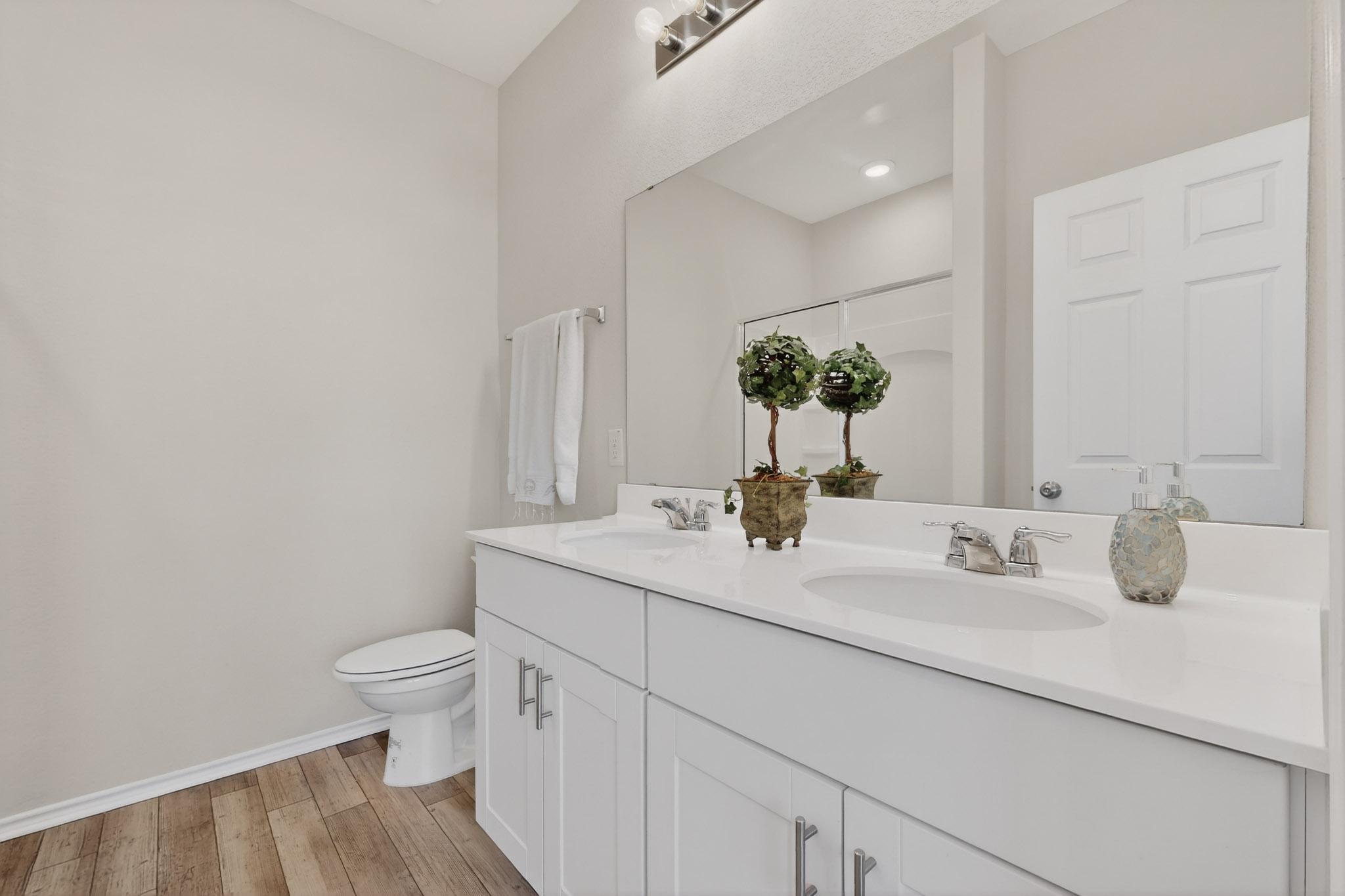 429 Stone Water Lane Jarrell, TX 76537 - Photo 18 of 37 a bathroom with a toilet sink and mirror