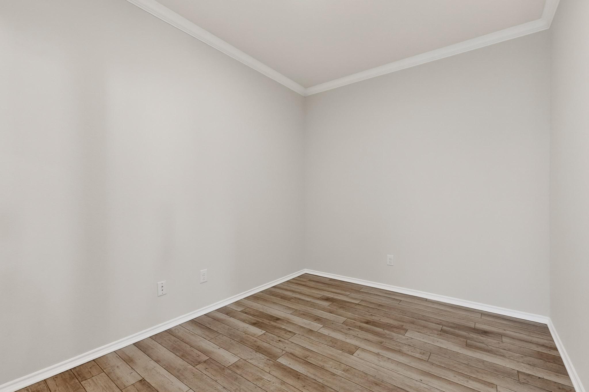 429 Stone Water Lane Jarrell, TX 76537 - Photo 21 of 37 a view of an empty room with wooden floor