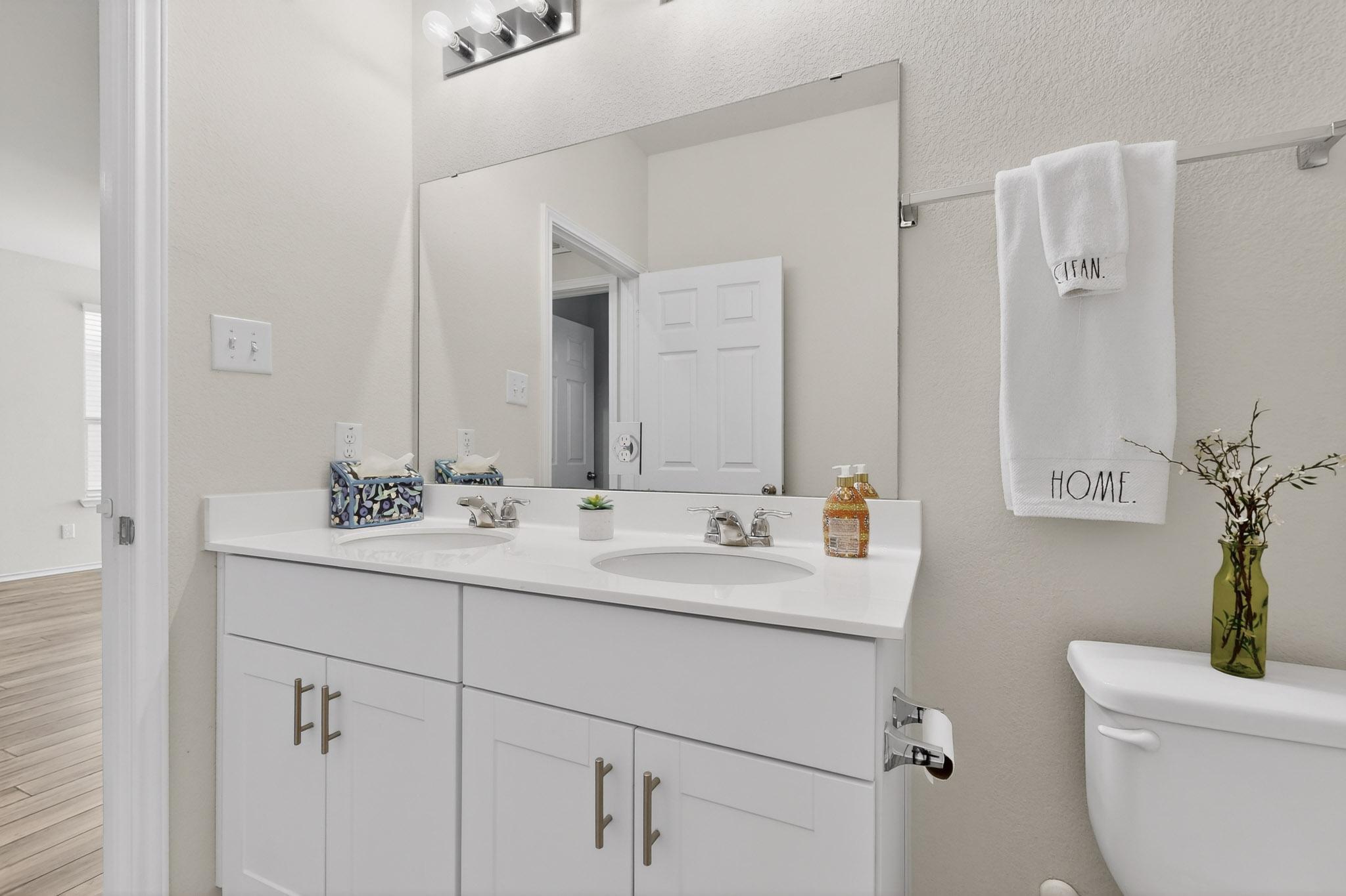 429 Stone Water Lane Jarrell, TX 76537 - Photo 22 of 37 a bathroom with a sink and a mirror