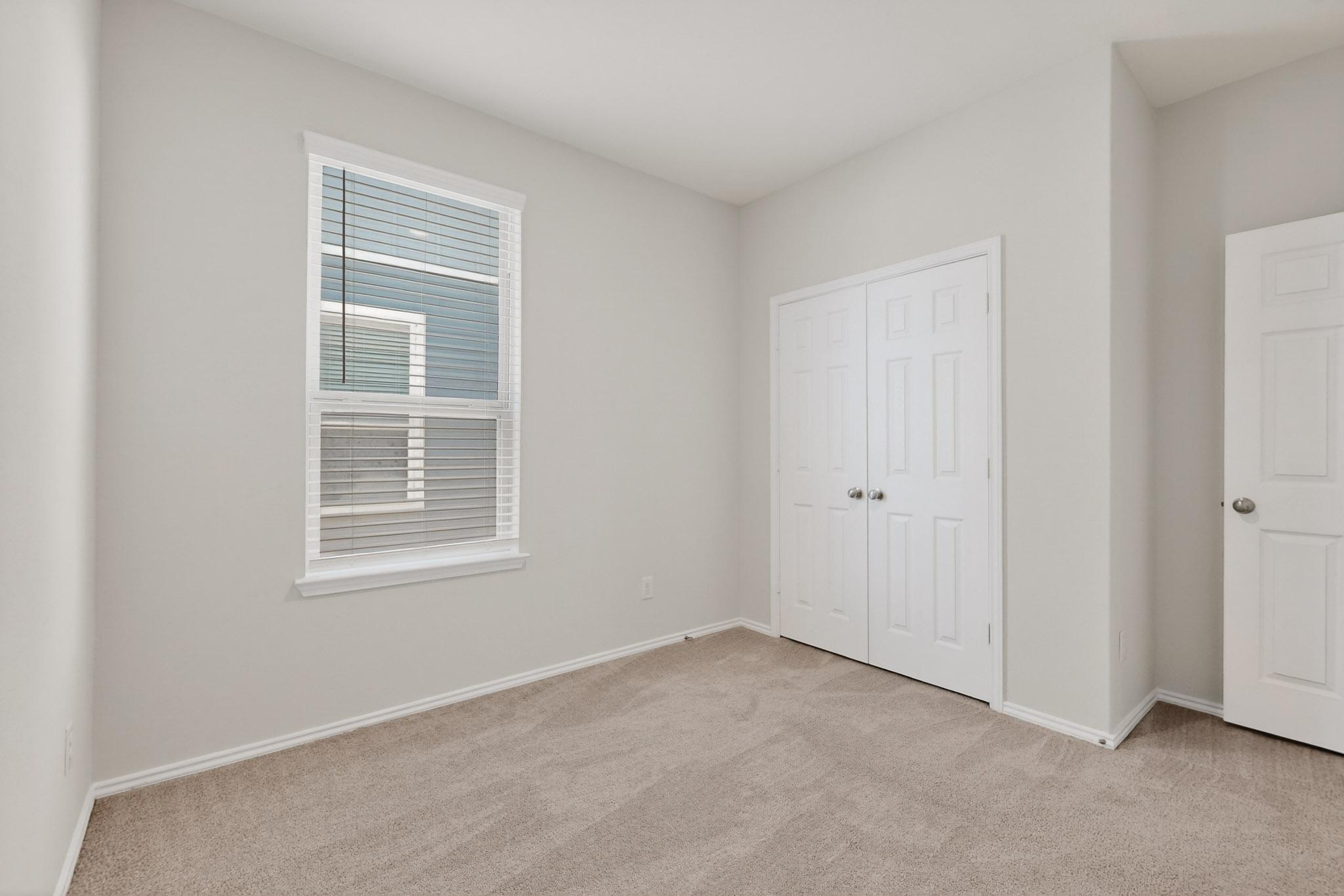 429 Stone Water Lane Jarrell, TX 76537 - Photo 27 of 37 an empty room with windows