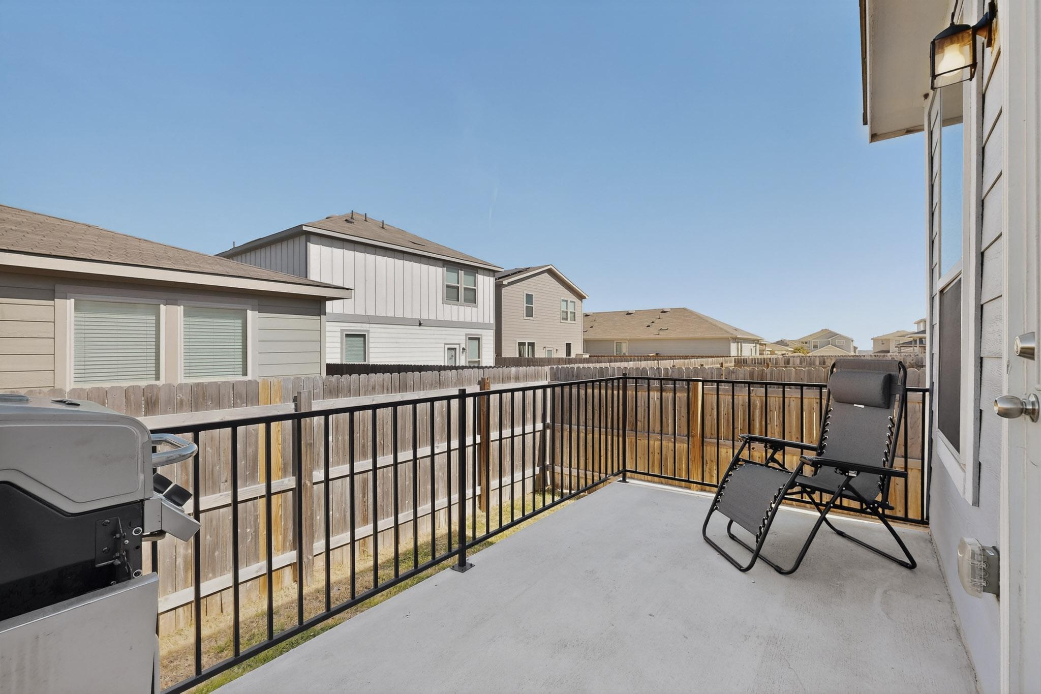 429 Stone Water Lane Jarrell, TX 76537 - Photo 33 of 37 a view of a roof deck with chair and wooden floor