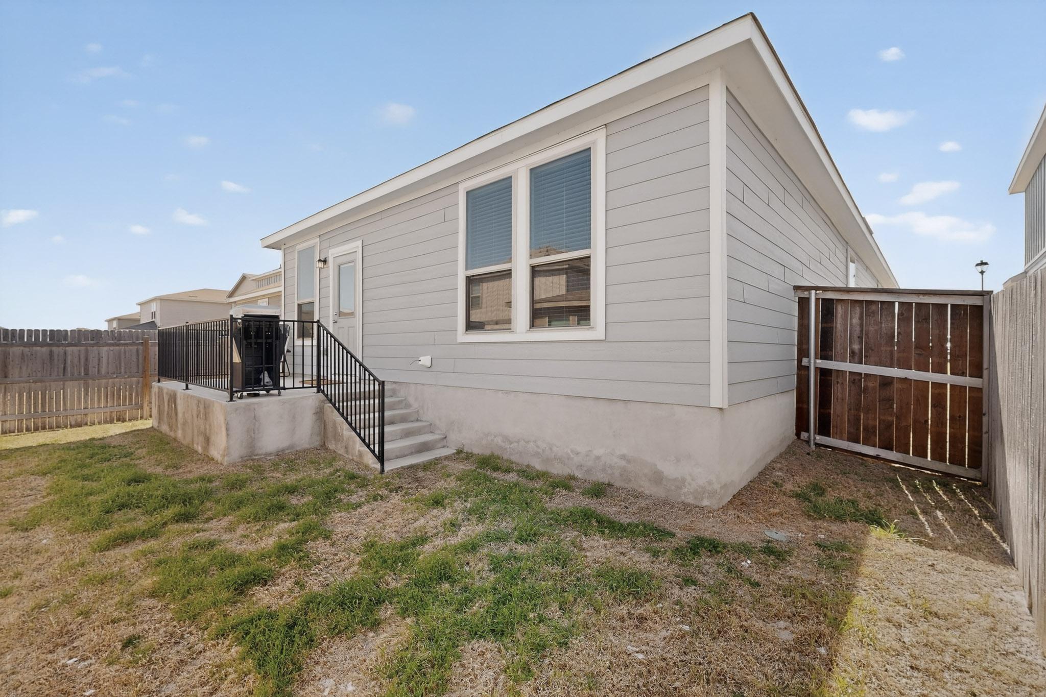 429 Stone Water Lane Jarrell, TX 76537 - Photo 35 of 37 a house view with a backyard