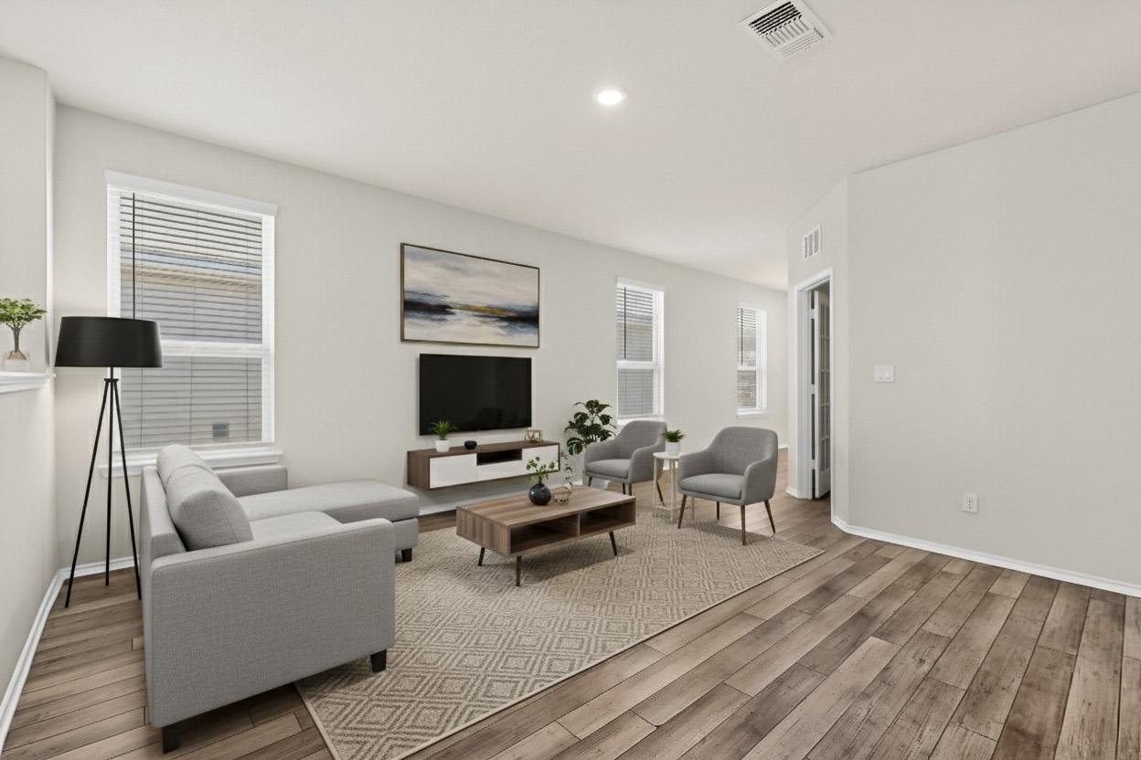 429 Stone Water Lane Jarrell, TX 76537 - Photo 4 of 37 a living room with furniture wooden floor and a flat screen tv