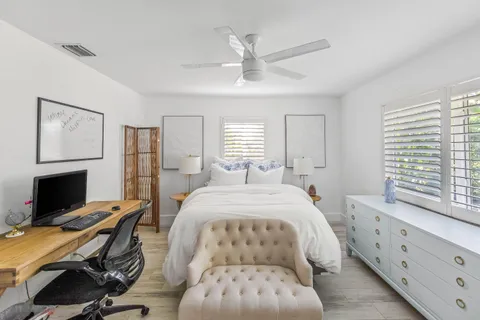 a bedroom with a bed and a couch