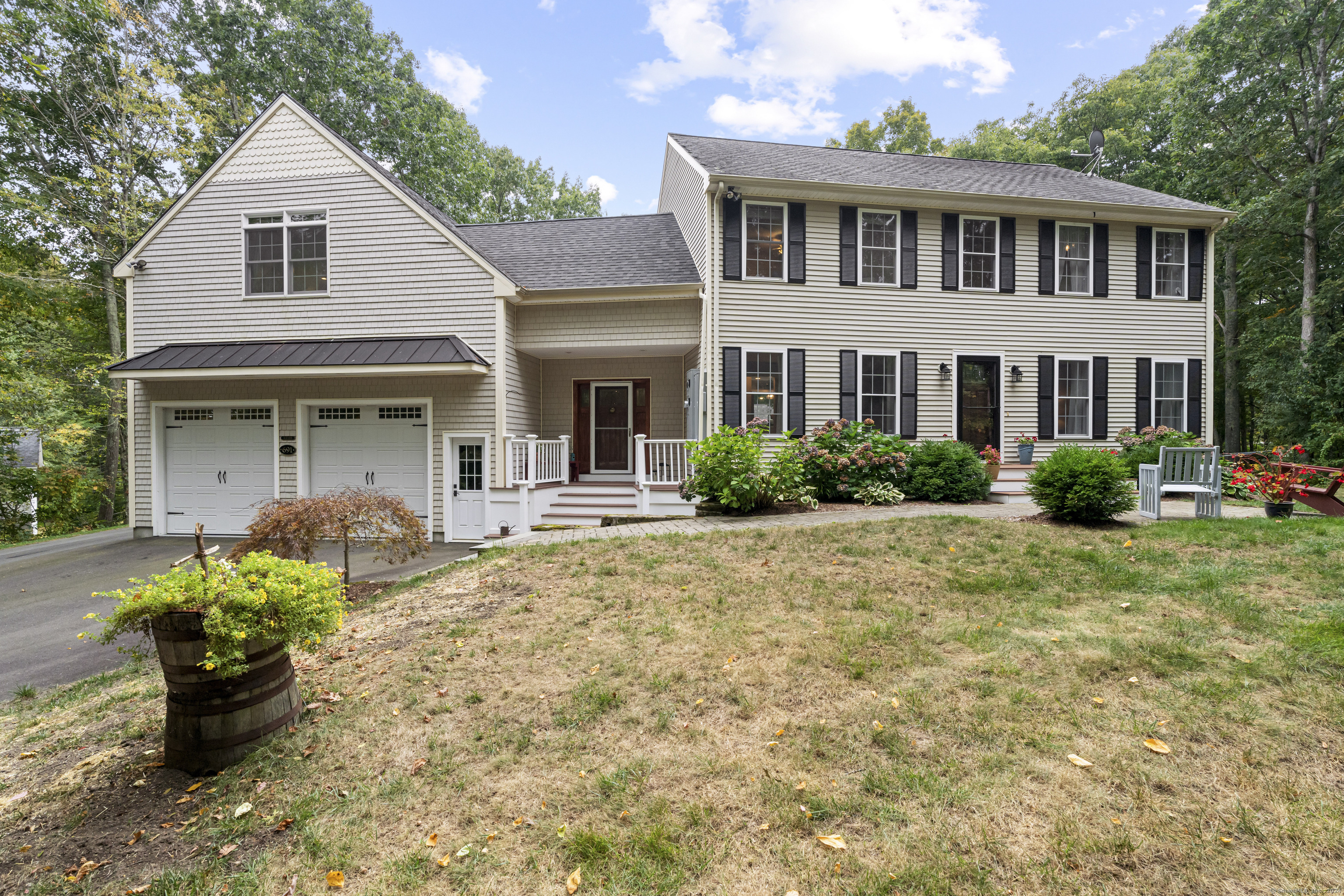691 East Pond Meadow Road Westbrook, CT 06498 - Photo 1 of 1 a front view of a house with a yard and porch