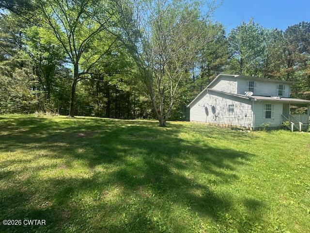 662 Blue Lane Huntingdon, TN 38344 - Photo 2 of 16 a view of a house with a yard
