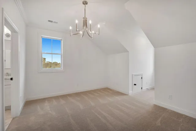 a bathroom with a toilet a sink a mirror and a window