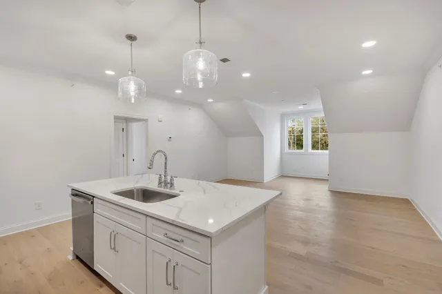 a kitchen with a sink and stove