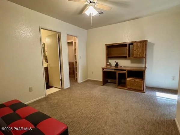a living room with furniture and flat screen tv