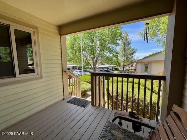 a view of balcony with wooden floor