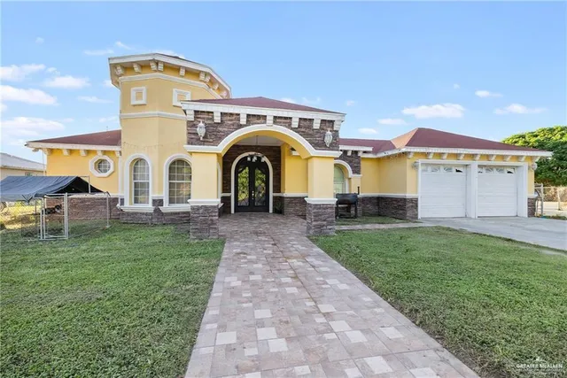 a front view of a house with garden
