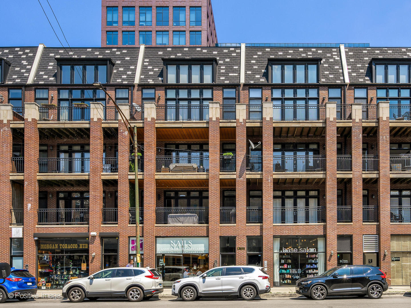 a front view of a building with a street