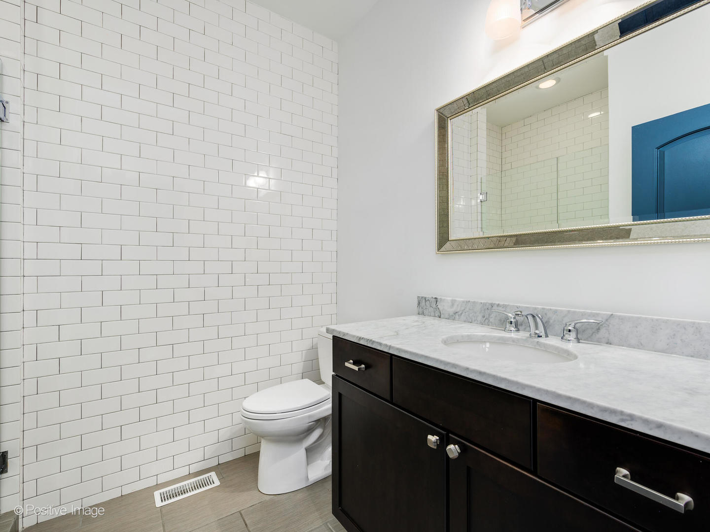 33 North Morgan Street, Unit PH Chicago, IL 60607 - Photo 19 of 24 a bathroom with a sink a toilet and mirror