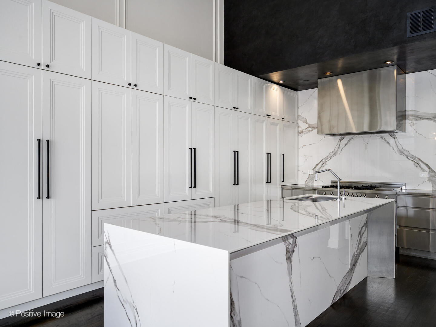 33 North Morgan Street, Unit PH Chicago, IL 60607 - Photo 2 of 24 a kitchen with stainless steel appliances granite countertop a sink stove and refrigerator