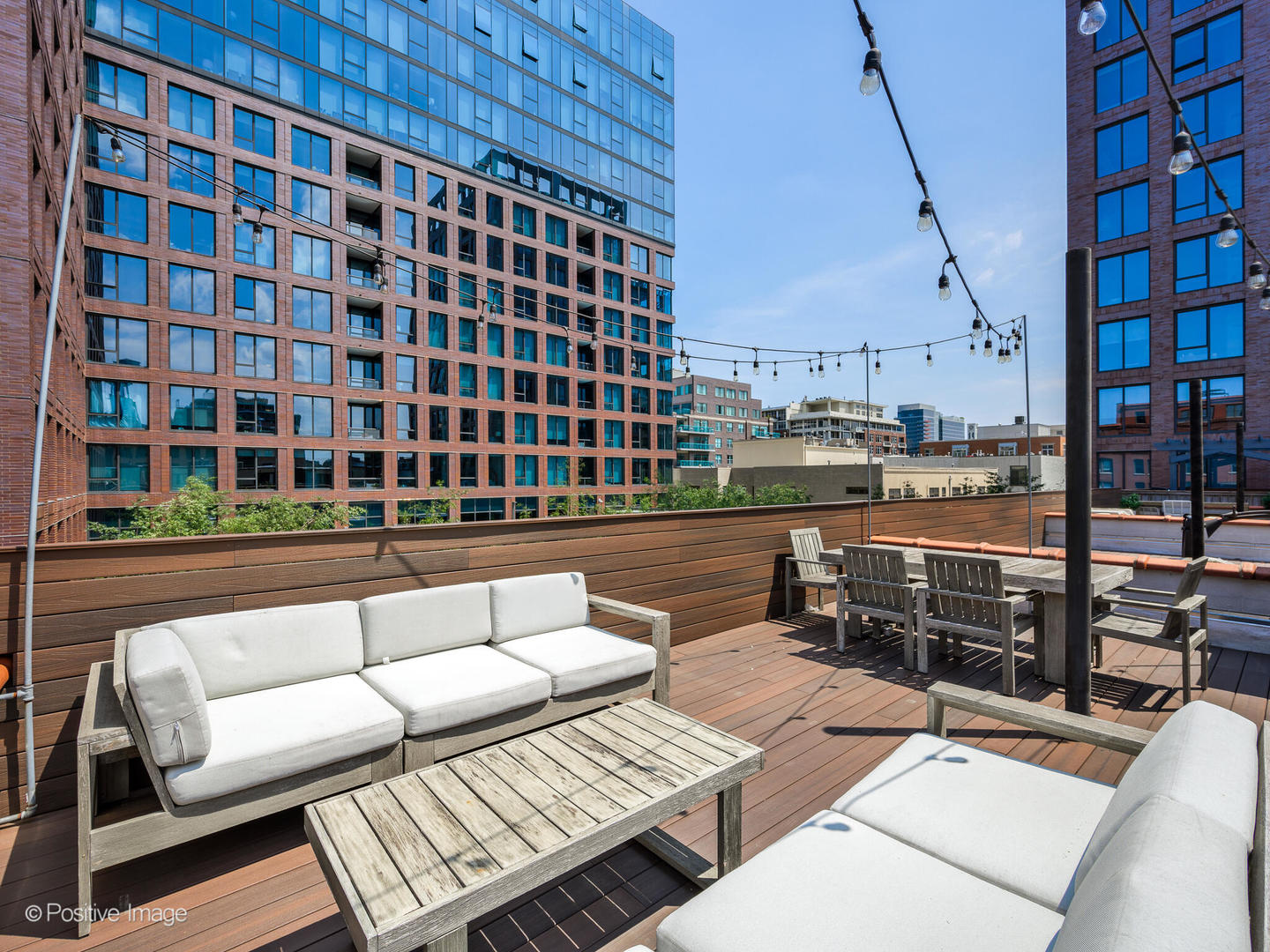 33 North Morgan Street, Unit PH Chicago, IL 60607 - Photo 22 of 24 a roof deck with couch and outdoor seating