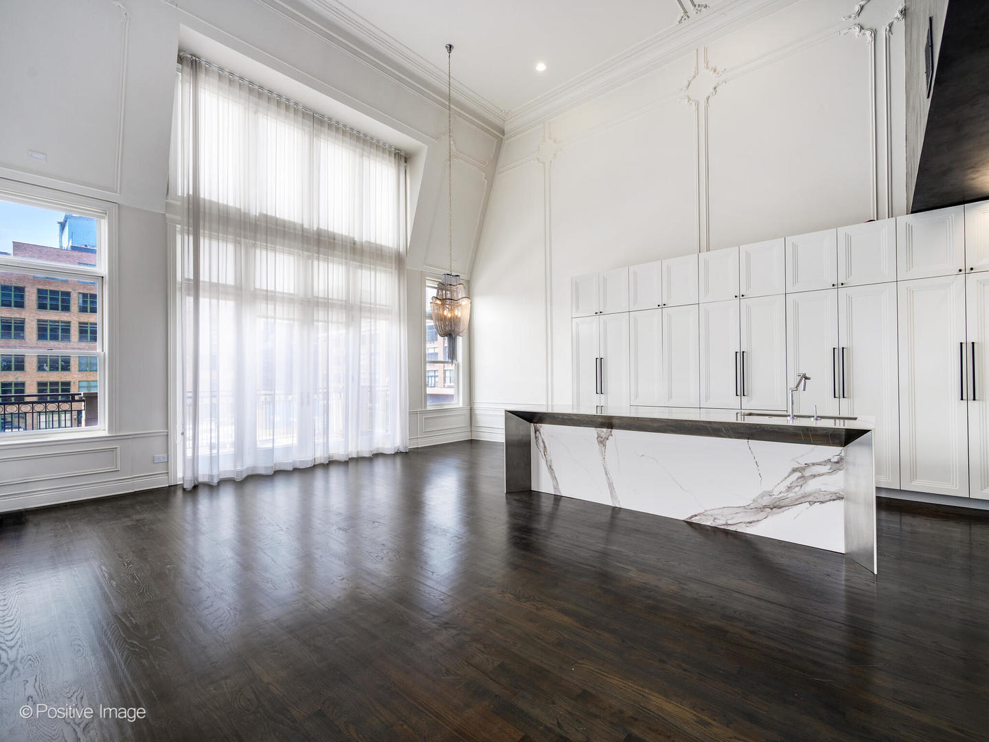 33 North Morgan Street, Unit PH Chicago, IL 60607 - Photo 6 of 24 a view of an empty room with wooden floor and a window