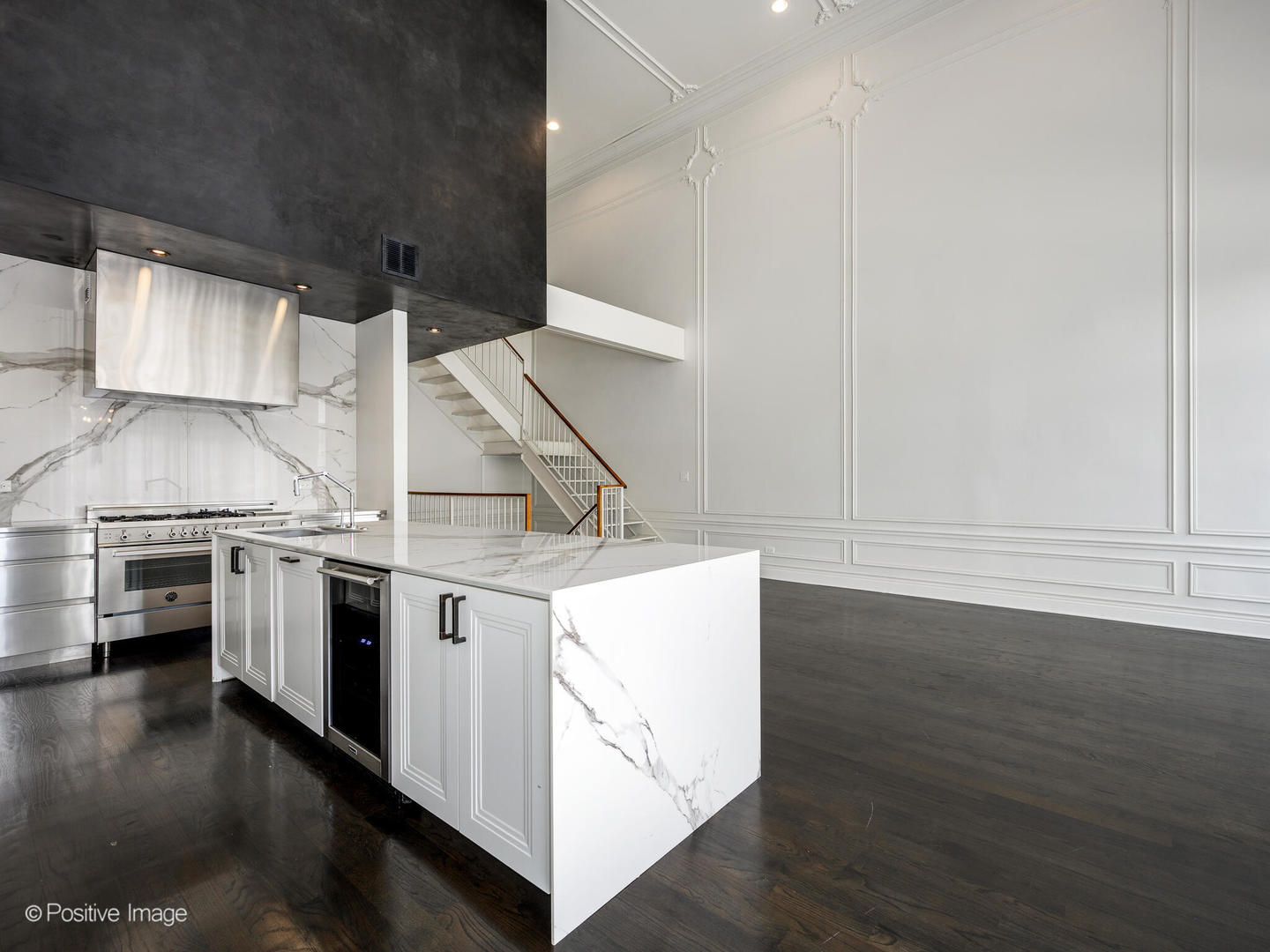 33 North Morgan Street, Unit PH Chicago, IL 60607 - Photo 7 of 24 a kitchen with stainless steel appliances a stove and white cabinets