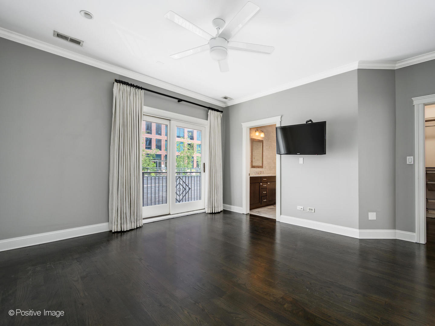 33 North Morgan Street, Unit PH Chicago, IL 60607 - Photo 10 of 24 a view of a livingroom with wooden floor and a ceiling fan