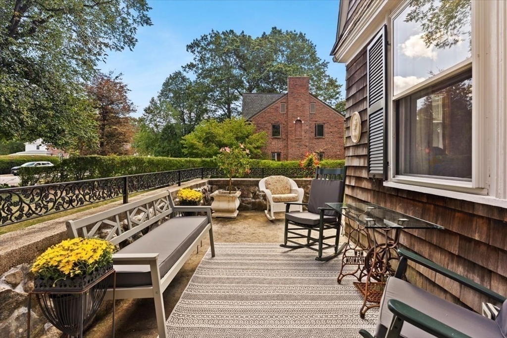 155 Mt Vernon Street Dedham, MA 02026 - Photo 16 of 50 a view of a balcony with chairs and wooden fence