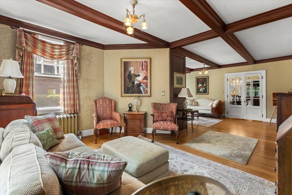 155 Mt Vernon Street Dedham, MA 02026 - Photo 19 of 50 a living room with furniture a chandelier and a large window