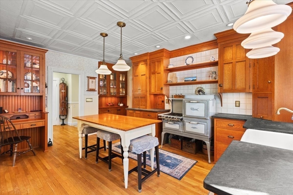 155 Mt Vernon Street Dedham, MA 02026 - Photo 30 of 50 a room with furniture a rug and a chandelier