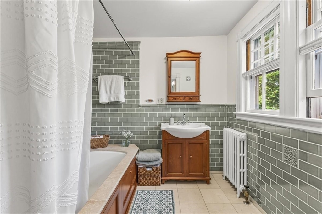 155 Mt Vernon Street Dedham, MA 02026 - Photo 36 of 50 a bathroom with a sink and a bathtub